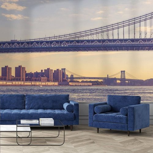 Afbeelding van een brug met een stadsgezicht van Dumbo in New York tijdens zonsondergang.
